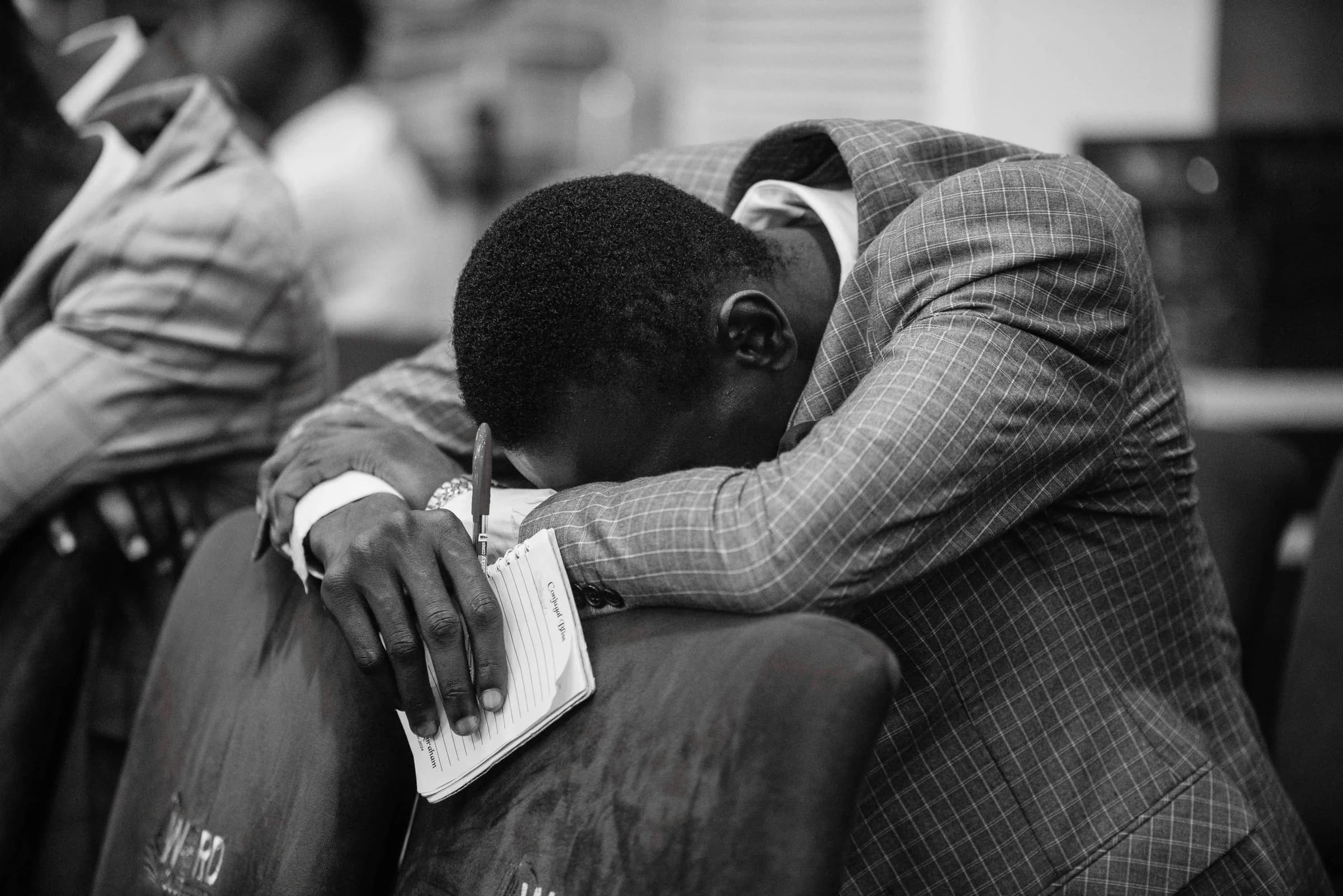 Person praying during a church service